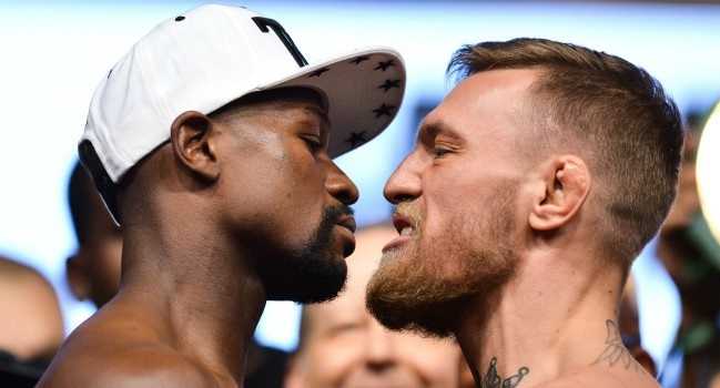 Floyd Mayweather Jr and Conor McGregor during the weigh in on August 25, 2017 at the T-Mobile Arena, Las Vegas, Nevada. Photo by PA Images / Icon Sport