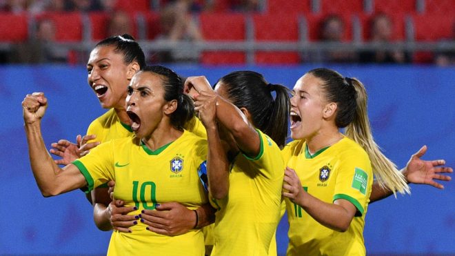 Brazil's forward Marta (2ndL) is congratulated by teammates after scoring a goal during the France 2019 Women's World Cup Group C football match between Italy and Brazil, on June 18, 2019, at the Hainaut Stadium in Valenciennes, northern France. (Photo by Philippe HUGUEN / AFP)