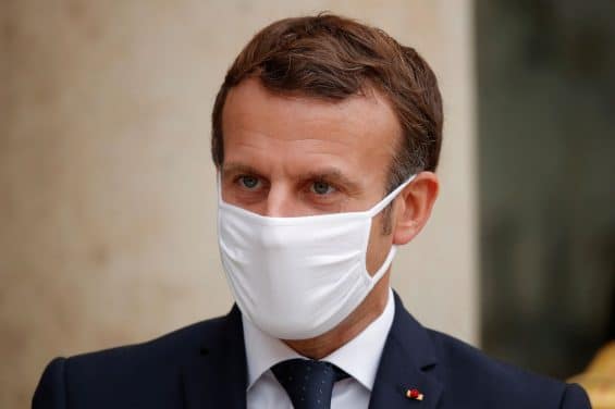 French President Emmanuel Macron, wearing a protective face mask, stands outside the Elysee Palace in Paris, France, October 28, 2020.  REUTERS/Charles Platiau