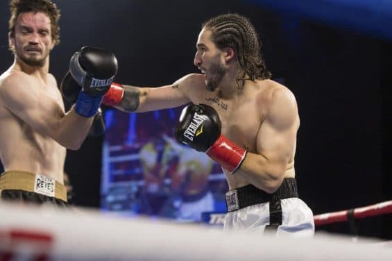 Nico Ali Walsh, right, hits Jordan Weeks during a middleweight boxing bout Saturday, Aug. 14, 2021, near Tulsa, Okla. (Brett Rojo/Tulsa World via AP)