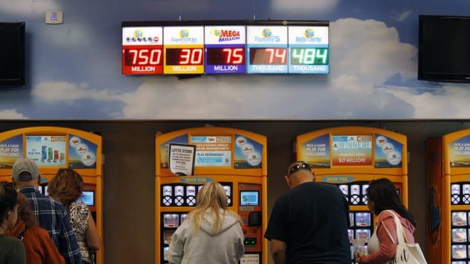 Jackpots, including the Powerball jackpot, are on display at the Lotto Store at Primm just inside the California border Wednesday, March 27, 2019, near Primm, Nev. The Powerball jackpot soared to a massive $750 million Wednesday. (AP Photo/John Locher)