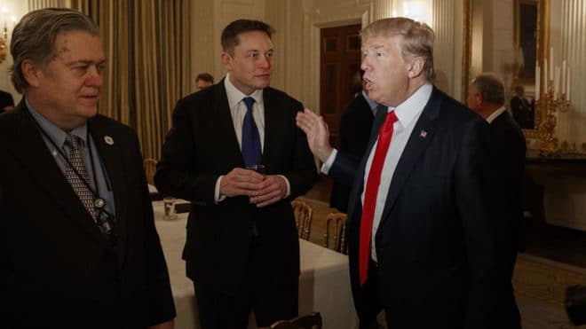 President Donald Trump talks with Tesla and SpaceX CEO Elon Musk, center, and White House chief strategist Steve Bannon during a meeting with business leaders in the State Dining Room of the White House in Washington, Friday, Feb. 3, 2017. (AP Photo/Evan Vucci)/DCEV101/17034561978611/1702031640