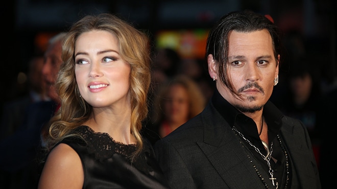 FILE - In this Oct. 11, 2015 file photo, Amber Heard, left, and Johnny Depp arrive at the premiere of Depp's film "Black Mass," at the London film festival. Court records show Heard filed for divorce in Los Angeles Superior Court on Monday, May 23, 2016, citing irreconcilable differences. The pair were married in February 2015 and have no children together. (Photo by Joel Ryan/Invision/AP, File)