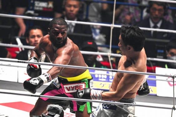 US boxer Floyd Mayweather (L) fights against Japanese mixed martial artist Mikuru Asakura during their exhibition boxing match at the Saitama Super Arena in Saitama on September 25, 2022. (Photo by Philip FONG / AFP)