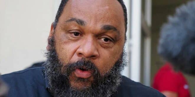 (FILES) In this file photo taken on June 22, 2020 French humorist Dieudonne MBala MBala speaks to medias outside the courthouse of Chartres prior to a hearing of his trial for alleged "racist and antisemitic comments". - The court will give its verdict on July 9, 2021 during the trial of Dieudonne and his wife on charges concealment of fraud and fraud. (Photo by Guillaume SOUVANT / AFP) FILES-FRANCE-JUSTICE-RACISM