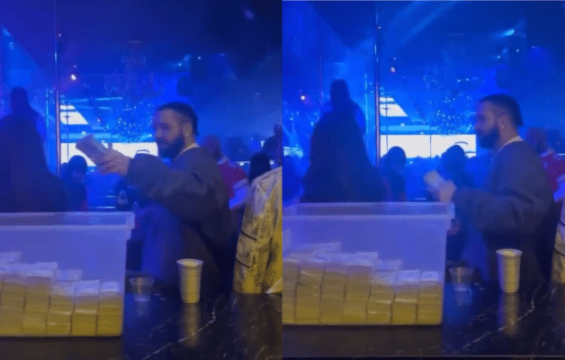 Drake se balade avec un bac de liasses en boîte de nuit